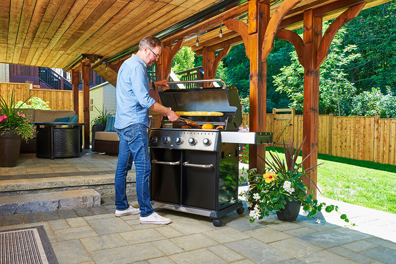 Man using grill outdoors
